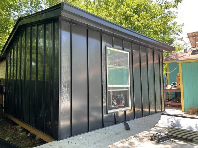 Black standing seam metal wall panels for Metal Roof Installation in Pierre